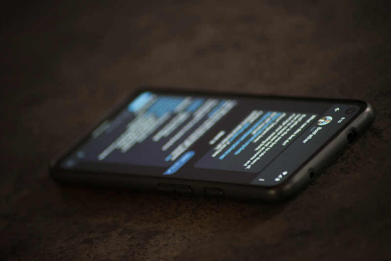Image of a cell phone on a table with an open app.